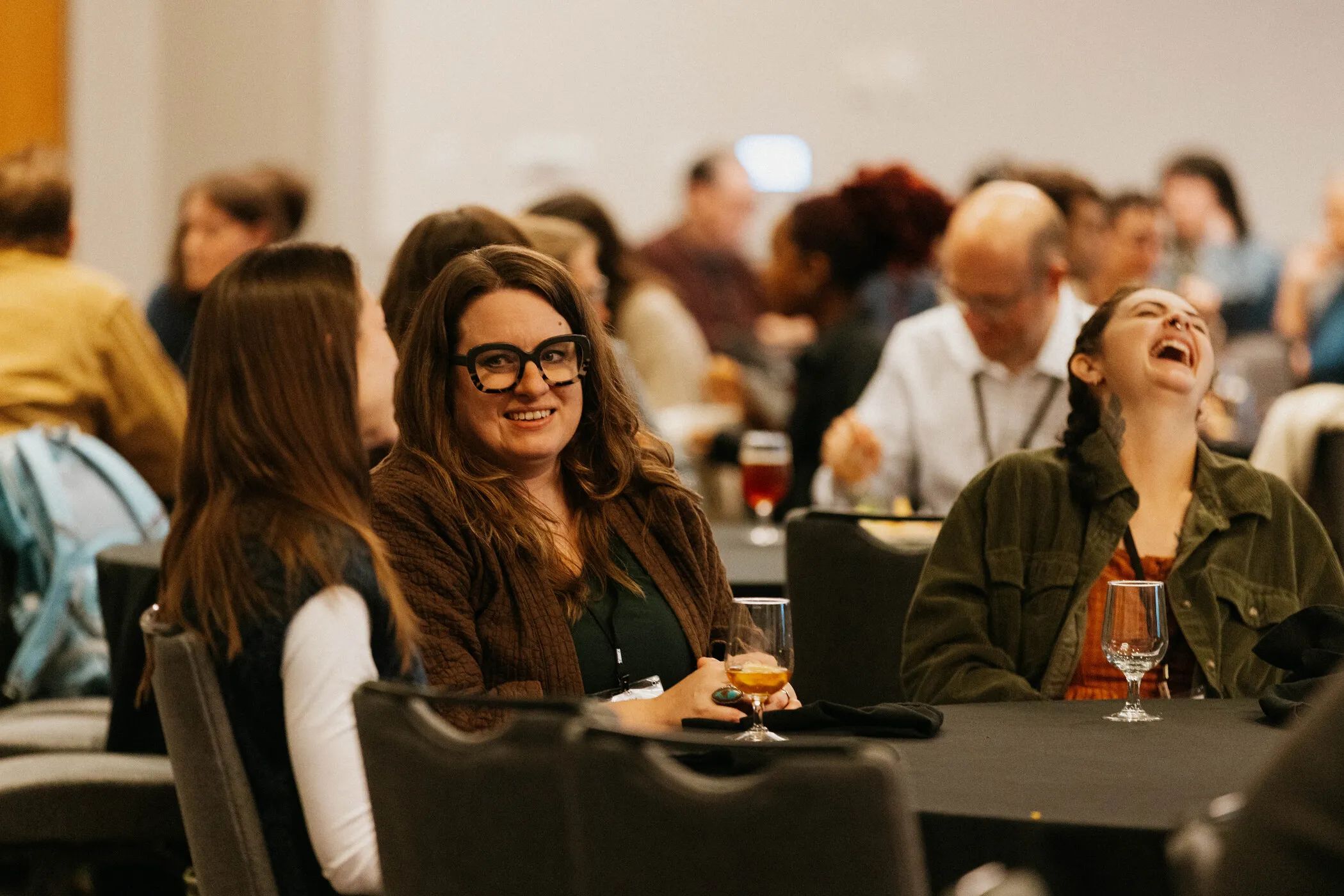 DLF Forum attendees seated together during a conference session.